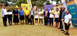 MTN Uganda and MTN Foundation staff pose for a group photo with the best performed graduands from Eastern Uganda in MTN's Digital Literacy Program. The best performing graduands were given laptops and internet. Courtesy Photo