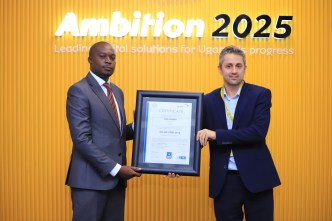 MTN Uganda Chief Technology and Information Officer, Ali Monzer (right) receiving International Standards Certifications – ISO 27001 on Information Security Management Systems certification on behalf of MTN Uganda.