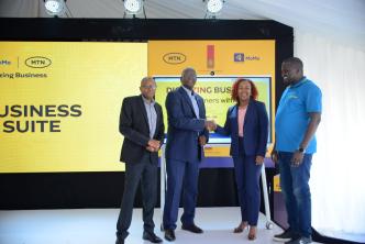 UBL Managing Director, Andrew Kilonzo and MTN CEO Sylvia Mulinge unveils FMCG Digital Suite in Kampala on Jukly 14. Looking on UBL Commercial Director, Ben Mbuvi (L) and MTN MoMo MD Richard Yego.