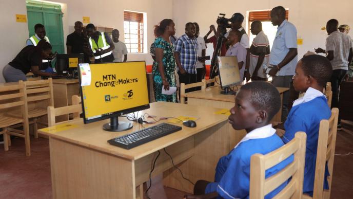 Pictured a group of students, community leaders, and MTN officials inside the newly refurbished state-of-art youth center in Tocau Karamoja that will foster digital literacy and promote education within the Karamoja region.