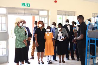 First Lady and Minister for Education and Sports, Janet Museveni (left), Charles Mbire, MTN Uganda Chairperson, and MTN Uganda Chief Executive Officer, Sylvia Mulinge at the commissioning of a computer library at the Salama School for the Blind in Mukono District.