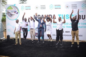 Hon. Dr. Monica Musenero Masanza (3rd from right), the Minister for Science, Technology & Innovation with other officials and partners jump as they launch the 2023 National Science week set to happen from 6-11, November.