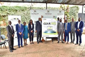 Reprenstatives from the Ministry of ICT and NITA-U pose for a group photo after announcing the reduction on the price of internet for government MDAs.