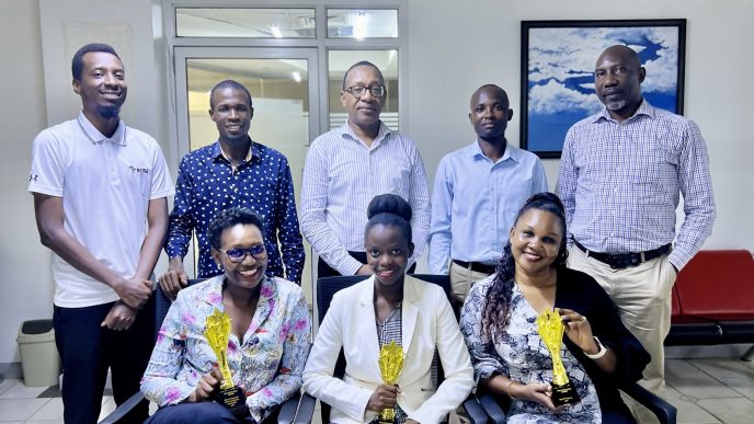 Part of the Media Age team pose for a group photo with the agency's won accolades. PHOTO: TBWA Uganda