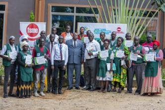 Charles Ichogor; Arua's Resident City Commissioner (4th from left in Grey suit) with representatives from PostBank Uganda and the Federation of Small and Medium Enterprises pose for a group photo with farmers and SMEs after a 4-day training under the PostBank Agri-SME Skills Development Program.