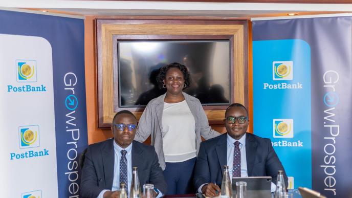 PostBank Uganda officials pose for a group photo after launching ZeroFlex digital account to enable its customers to self-register. COURTESY PHOTO