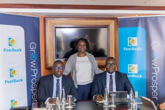 PostBank Uganda officials pose for a group photo after launching ZeroFlex digital account to enable its customers to self-register. COURTESY PHOTO