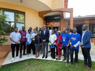 Roger Sekaziga (center in glasses), CEO Roke Telkom Poses for a photo with Jesuit Refugee Service students after they took a tour of Roke Telkom offices. COURTESY PHOTO