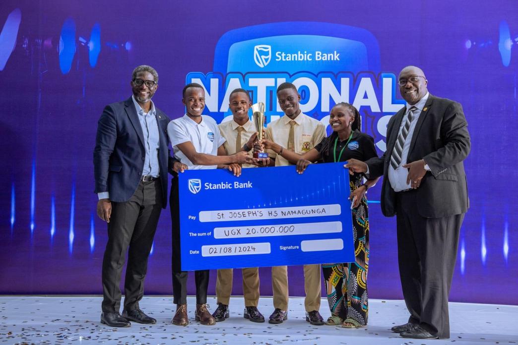 Students of St Josephs High School Namagunga awarded a dummy cheque, and an accolade after emerging as the overall winner of the 9th edition of the Stanbic National Schools’ Championship finals. COURTESY PHOTO