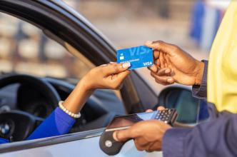 Pictured a customer paying for their service using a visa card. COURTESY PHOTO.