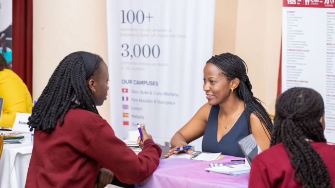 Hairah Kibuuka (center), the Managing Director of Sharz pictured speaking to some students. COURTESY PHOTO