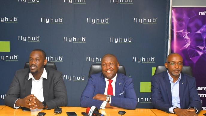 In Pictorial (L-R): Joel Muhumuza; FlyHub CEO, Andrew Mashanda; CEO Stanbic Uganda Holdings Ltd, and Michael Niyitegeka; Refactory Academy Programme Director settling in a press conference to brief the media on their partnership.