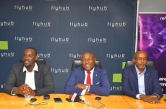 In Pictorial (L-R): Joel Muhumuza; FlyHub CEO, Andrew Mashanda; CEO Stanbic Uganda Holdings Ltd, and Michael Niyitegeka; Refactory Academy Programme Director settling in a press conference to brief the media on their partnership.