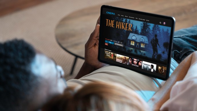 A man pictured selecting to watch a movie on a video streaming service. PHOTO: Freepix