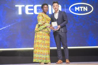 Rosemary Seninde Nansubuga (left) and Tecno Brand Manager, Timmy Shen display one of the Tecno Camon 30 smartphones after launching the series at the event held at the Kampala Serena Hotel. PHOTO: PC Tech Magazine