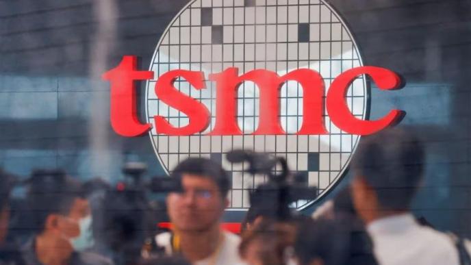 Taiwan Semiconductor Manufacturing Company's (TSMC) logo is seen while people attend the opening of the TSMC global R&D center in Hsinchu, Taiwan July 28, 2023. REUTERS/Ann Wang/File photo