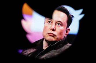 FILE PHOTO: Elon Musk's photo is seen through a Twitter logo in this illustration taken October 28, 2022. REUTERS/Dado Ruvic/Illustration