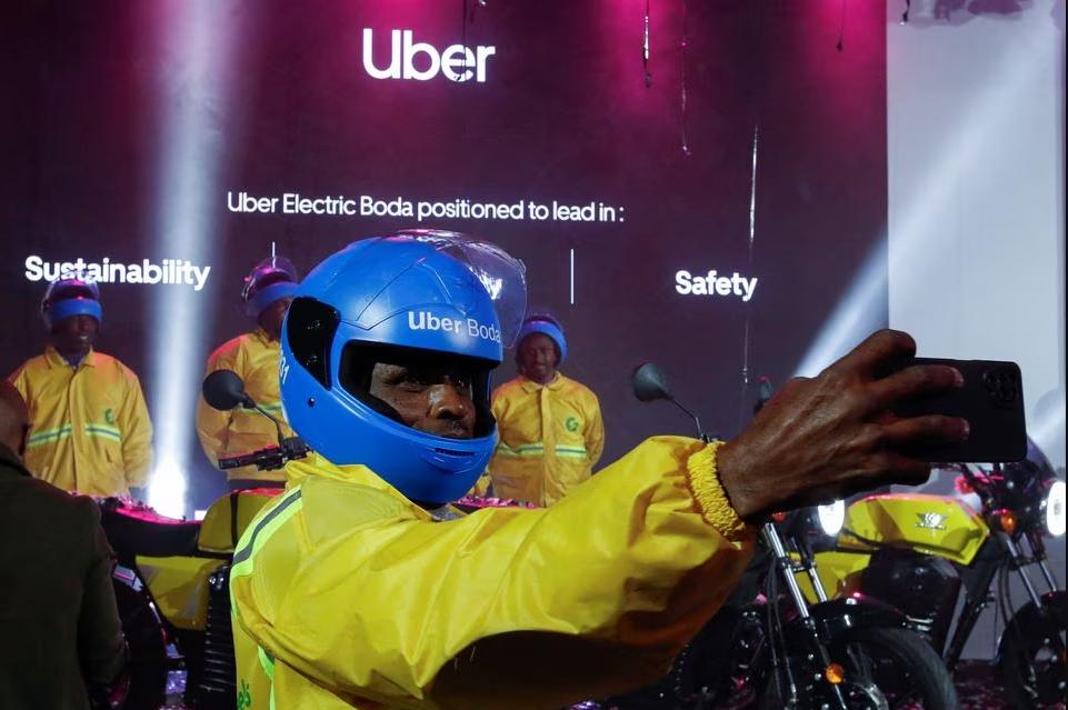 An Uber boda boda rider takes a selfie after the launch of the company's first fleet of electric product in Nairobi, Kenya, August 31, 2023. REUTERS/Monicah Mwangi