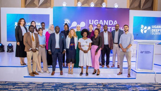 Minister of Science, Technology, and Innovation, Dr. Monica Musenero (white drees) poses for a group photo with delegates at the inaugural Uganda deep technology summit. Courtesy Photo