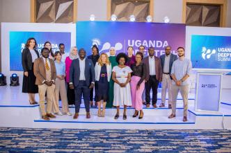 Minister of Science, Technology, and Innovation, Dr. Monica Musenero (white drees) poses for a group photo with delegates at the inaugural Uganda deep technology summit. Courtesy Photo