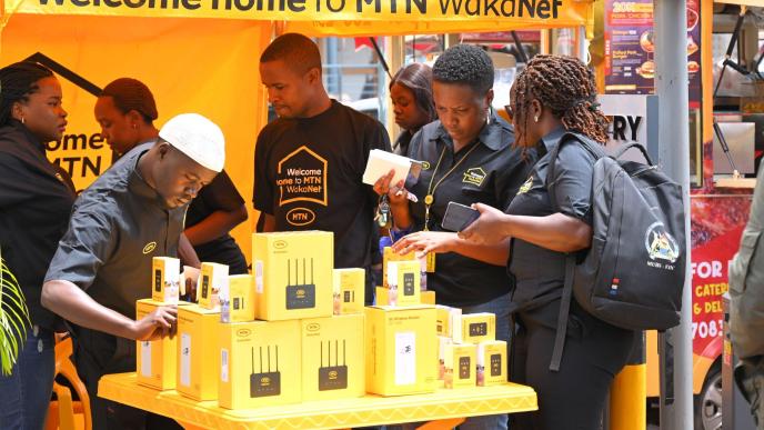 Customers pictured buying WakaNet MiFis which instantly comes with 5GB free data and flexible data options to keep you going. PHOTO: MTN Uganda