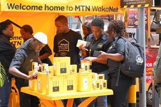 Customers pictured buying WakaNet MiFis which instantly comes with 5GB free data and flexible data options to keep you going. PHOTO: MTN Uganda