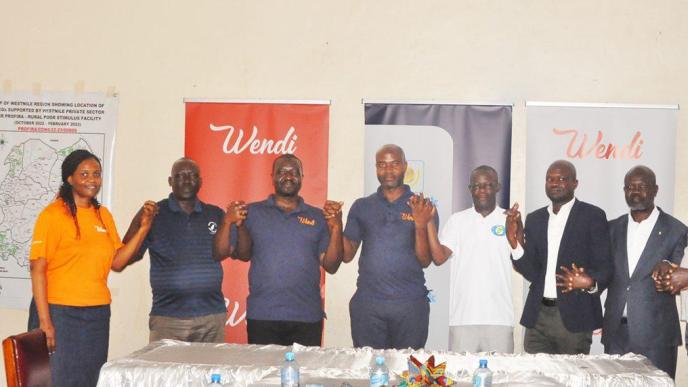 PostBank and WENIPS officials pose for a group photo after announcing their partnership which aims at improving access to financial services to the West Nile community through Village Saving and Loan Associations via the Wendi Mobile Wallet. Courtesy Photo