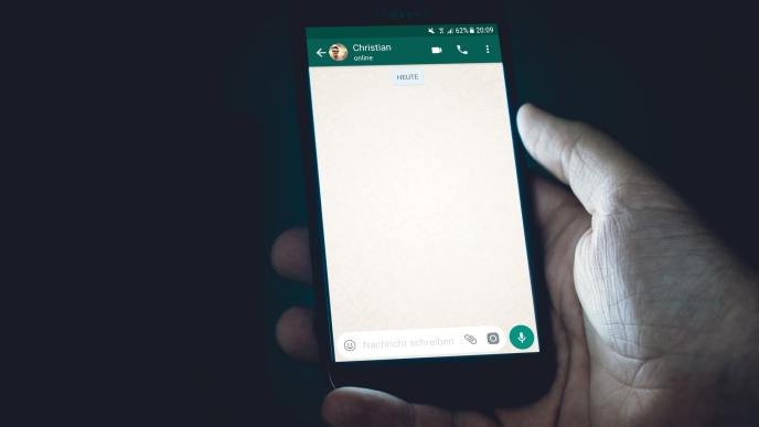 A user displaying a new default WhatsApp chat. (PHOTO: Christian Wiediger/Unsplash)