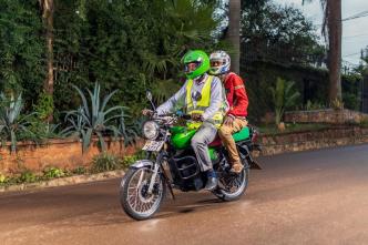 Pictured a rider in Uganda carrying a passenger on an electric motorcycle by Zembo. More than 90% of e-motorcycles sold in sub-Saharan Africa are imported from China and India and are not built for African conditions. (COURTESY PHOTO)