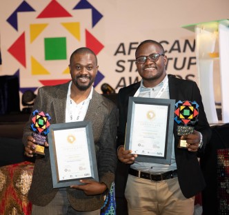 Paul Kirungi (left); founder and CEO of Zofi Cash, and Keneth Twesigye (right), CEO of Tech Buzz Hub pose for a photo with their accolades and certificates after emerging victorious at the 2023 Global Startup Awards Africa held in Addis Ababa, Ethiopia.