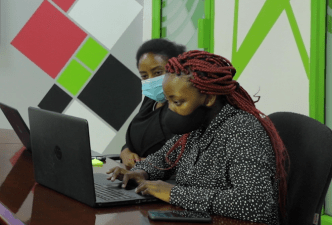 Sheila Kakwezi and Grace Namatende, tutors with Afro Fem Coders.